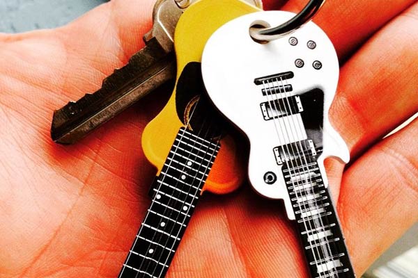 two Guitar Shaped Keys on hand